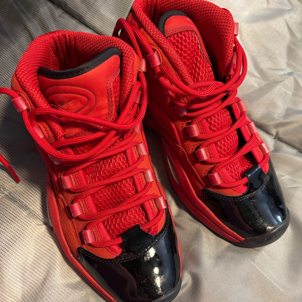 Reebok Red Sneakers with High-Top Design and Shiny Black Accents
